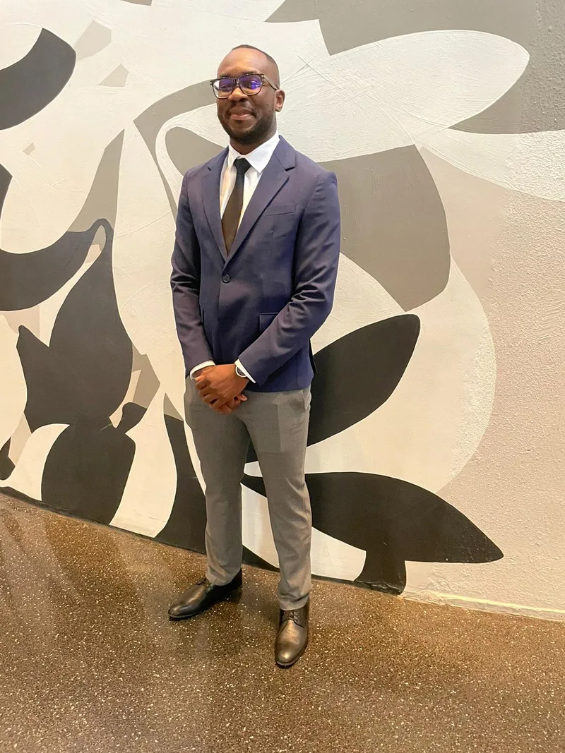 Anthony Omini in a navy suit