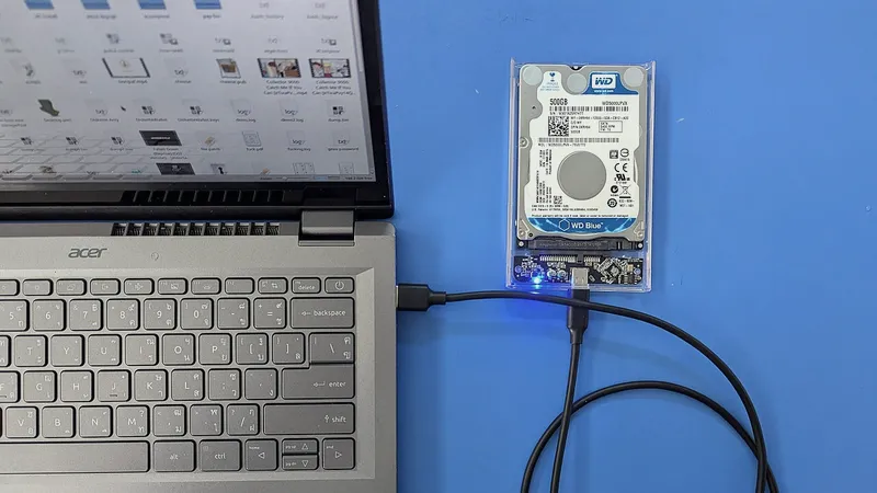 External hard drive connected to a laptop by cable
