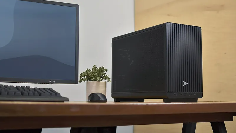 Desktop computer tower and monitor on a wooden desk